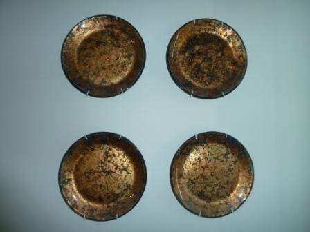 These are plates I actually did myself with mixed metal leaf and some glass paint, but I display my TJ Maxx plates the same way.