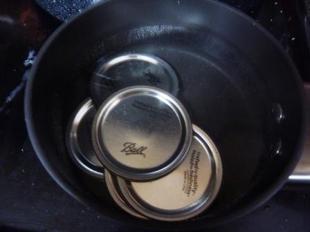 I do the lids in my smallest saucepan.  Your stove top can get pretty crowded, so it' nice that at least one burner not be a space hog.